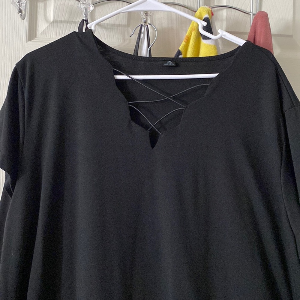 Black shirt 4x but fits like a 3x